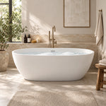 Oval freestanding solid surface soaking bathtub in a naturally lit bathroom with large window