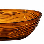 Close-up view of rippled amber tub rim and layered wavy surface