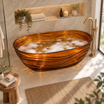 Amber textured oval freestanding tub in marble bathroom with glass shower partition and large window