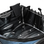 Interior close-up of multiple massage jets, dual black headrests and control buttons inside the tub