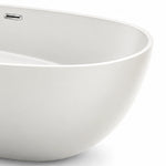 Close-up of bathtub rim, showing smooth edge and built-in side overflow opening