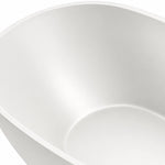 Close-up of bathtub inner wall, featuring smooth matte surface and soft curved corner