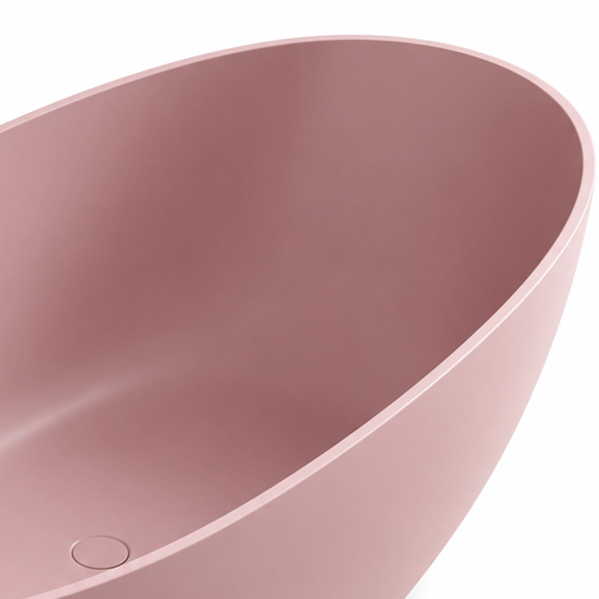 Angled close-up of bathtub wall, displaying rounded rim curve and thick solid edge