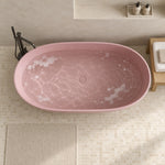 Top view of pink freestanding bathtub inside simple bathroom with beige tiled floor