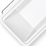 Close-up of bathtub rim, thickened acrylic edge with streamlined inner groove and glossy smooth surface