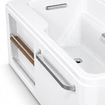Bathtub side detail with external long metal grab bar and open storage compartment with wooden shelf