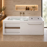 Skirted acrylic bathtub with side storage niche, placed in bathroom with travertine tiled wall