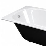 Bathtub rim close-up, glossy white top edge with black exterior, equipped with silver overflow outlet and rounded corners