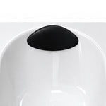 Bathtub pillow close-up, curved black soft headrest matching tub contour, smooth surface for comfortable bathing support