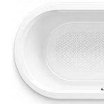 Close-up of curved bathtub end rim, smooth white acrylic edge with chevron anti-slip pattern inside the basin