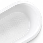 Partial close-up of bathtub corner, seamless rounded rim, anti-slip texture extending across the tub interior