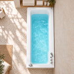 Top-down view of walk-in bathtub, bathroom with terrazzo tile floor and wooden countertop beside