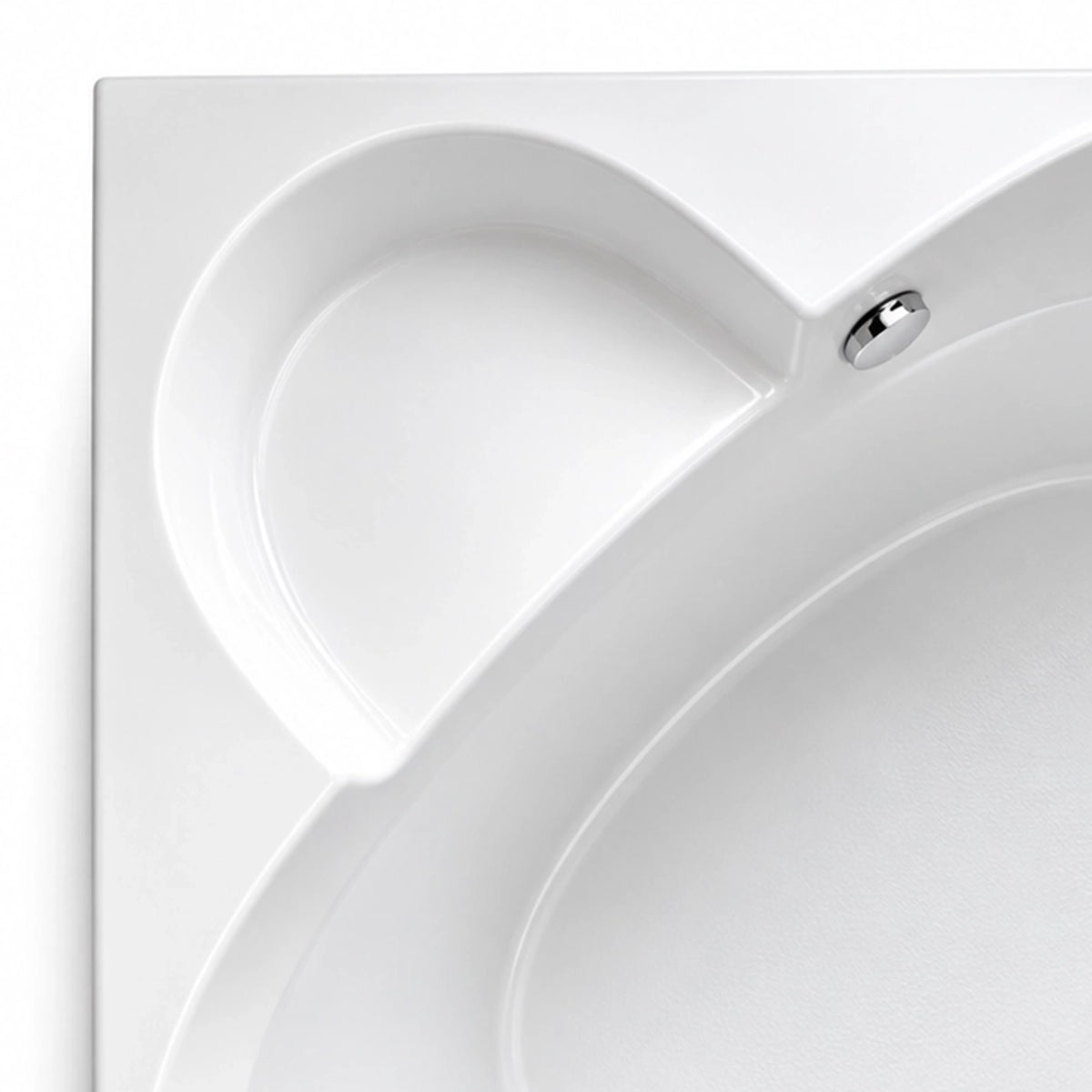 Close-up of built-in tub backrest, seamless molded glossy acrylic surface with polished metal overflow fitting