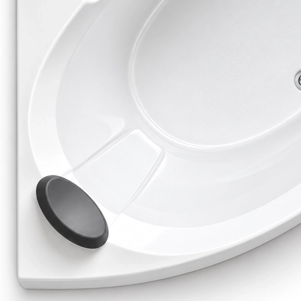 Close-up of matte black soft bath headrest mounted on tub rim, smooth and glossy acrylic wall