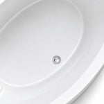 Close-up of polished metal drain at tub bottom, fine and smooth inner acrylic surface