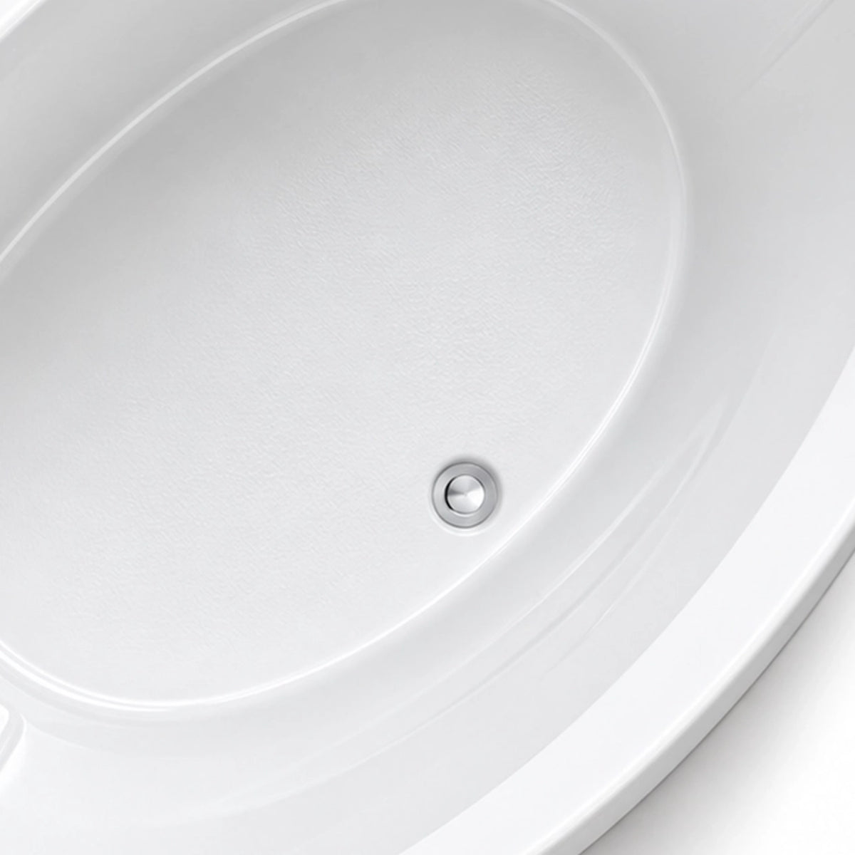 Close-up of polished metal drain at tub bottom, fine and smooth inner acrylic surface