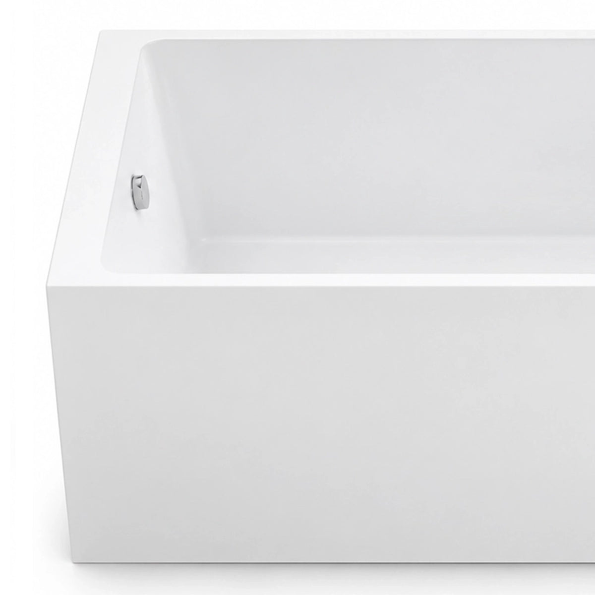 Bathtub corner close-up, showing thin rim and inner silver overflow fitting with smooth white surface