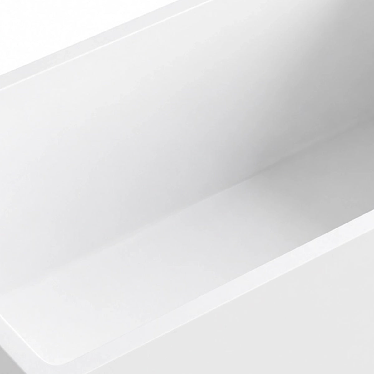 Partial shot of bathtub inner wall, seamless smooth white surface with continuous rim transition
