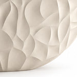 Partial close-up of bathtub exterior, showcasing curved concave-convex relief surface details