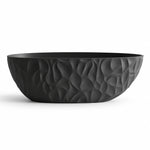 Freestanding oval soaking tub,black body with sculpted concave-convex surface pattern