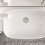 Top view of glossy ceramic sink basin and drain hole