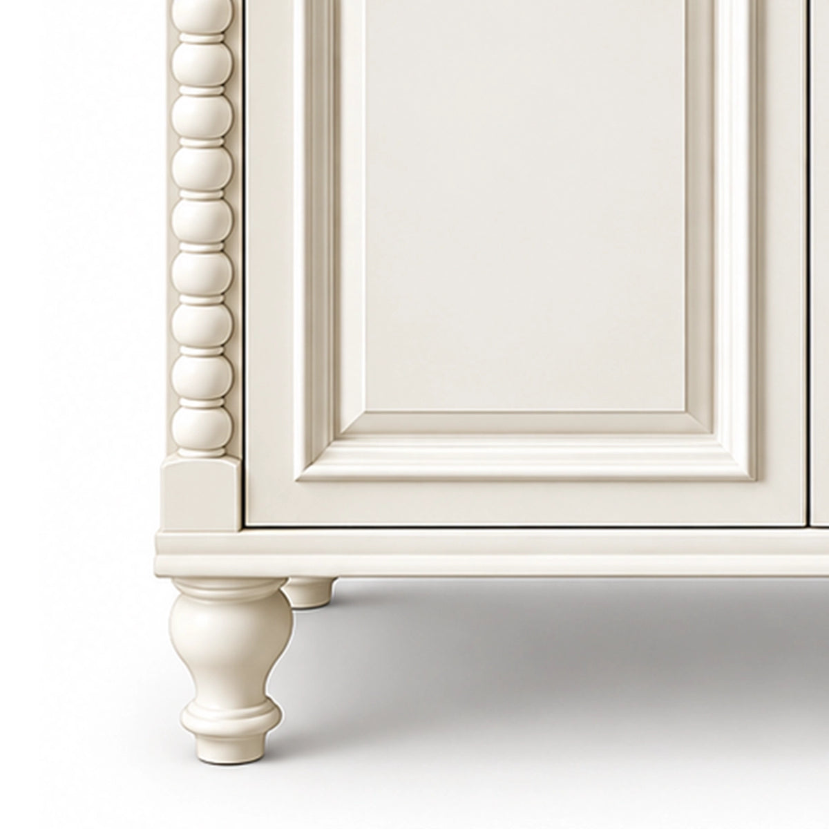 Close‑up of beaded column and carved cabinet leg