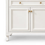 Close‑up of raised cabinet door and curved furniture leg
