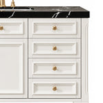 Multi‑drawer panel moulding and round gold pull knobs