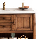 Countertop and cabinet close-up, white quartz top with antique brass faucet