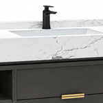 Sink faucet close-up, white stone countertop with matte black faucet