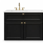Close‑up of cabinet module, recessed panel drawer & double doors, X‑cross gold pulls, white quartz countertop