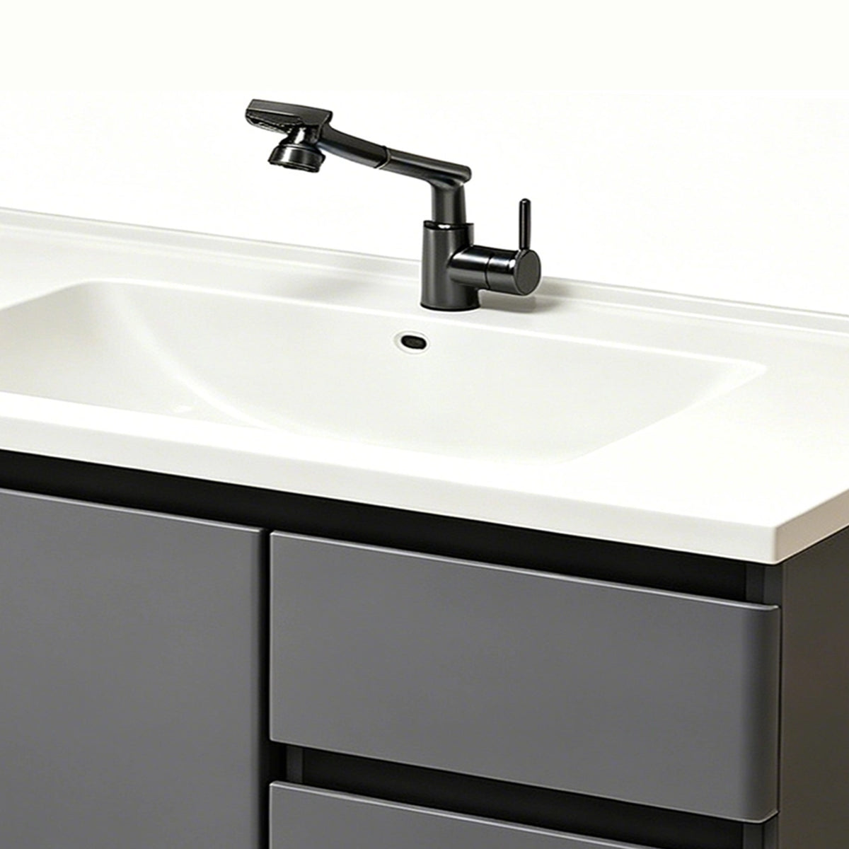 Close‑up of swivel faucet and ceramic sink basin