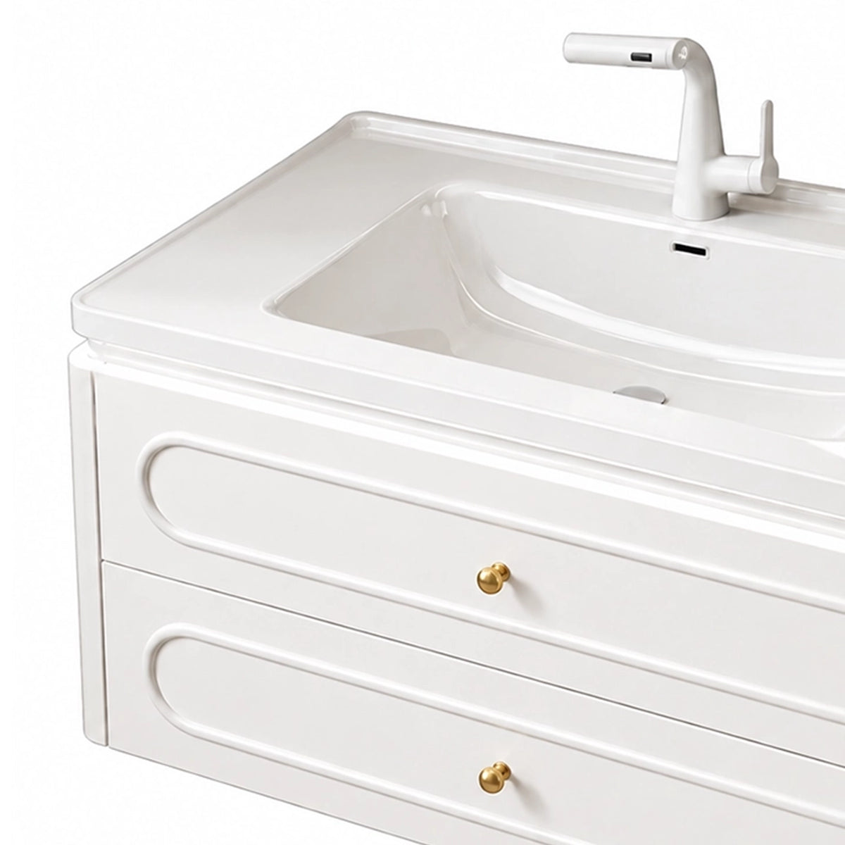 Partial view of drawers and sink, curved embossed drawer fronts, gold metal knobs, white pull‑out faucet, integrated ceramic basin