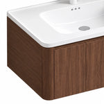 Cabinet corner close‑up, rounded corner design, brown wood grain, seamless joint with white integrated sink top