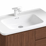 Sink & faucet partial shot, deep integrated ceramic basin, white pull‑out faucet, countertop overflow holes