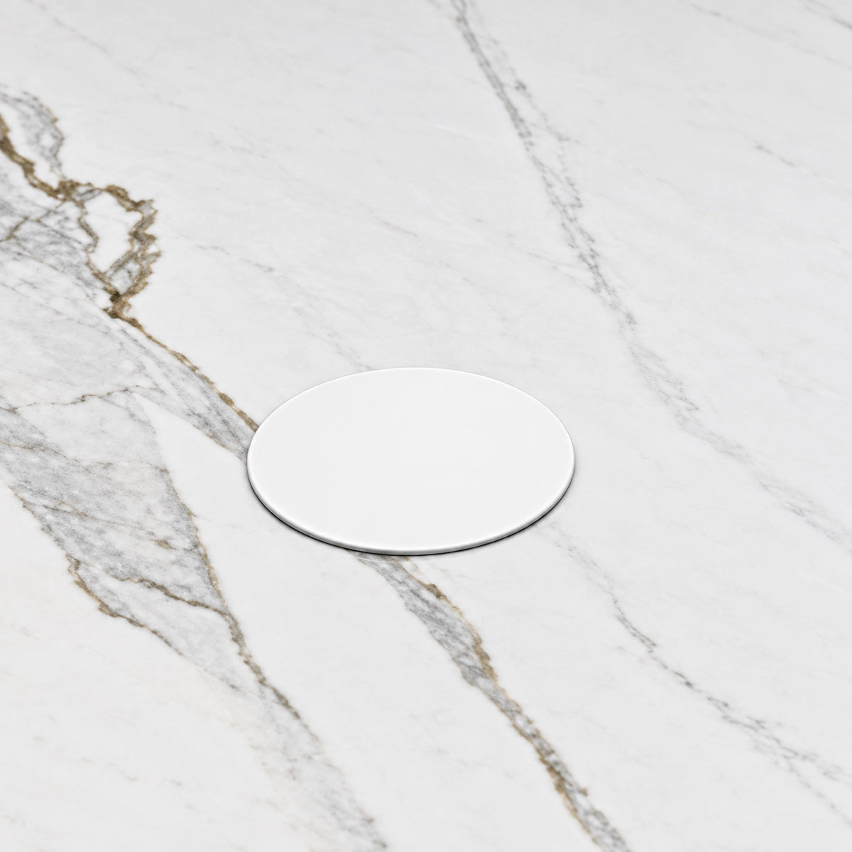 Detail shot of circular white drain cover on marble top