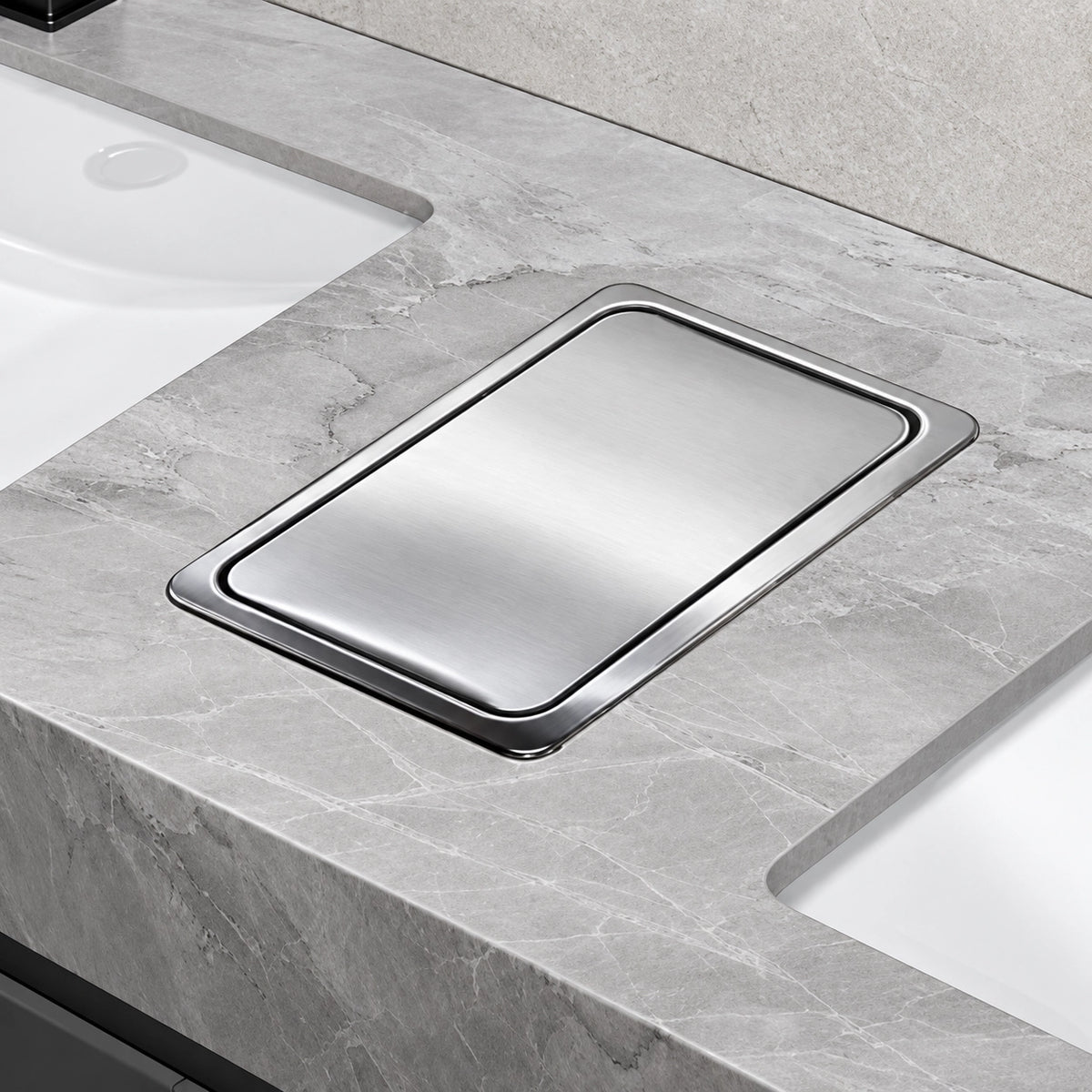Stainless steel waste cutout on stone countertop, top view
