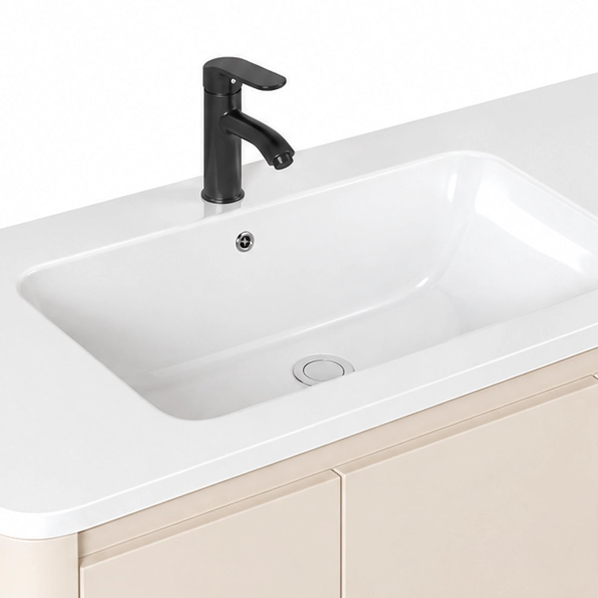 Close‑up of integrated ceramic sink and black faucet