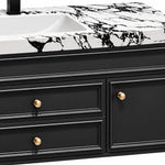 Vanity drawer detail, gold round knobs and raised‑line cabinet doors