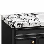 Vanity corner detail, joint of black‑white marble top and black cabinet body