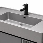 Vanity sink detail, grey integrated stone sink with square black faucet