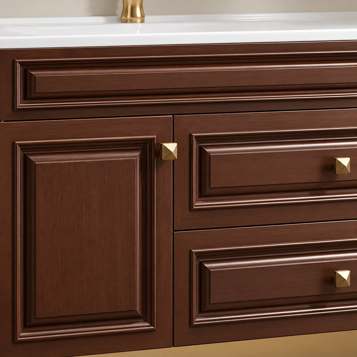 Brown vanity cabinet door detail, raised‑panel door with square gold knobs