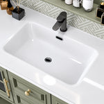 Sink close‑up, integrated white ceramic basin with black single‑hole faucet