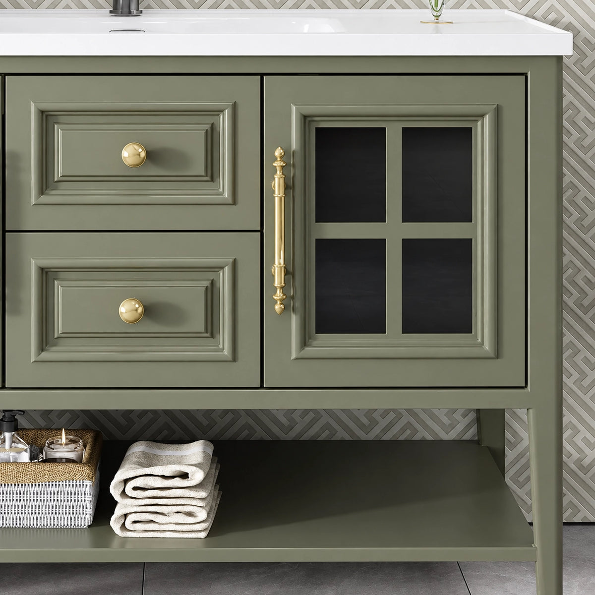 Cabinet detail, grid glass door with gold handles, open shelf with folded towels