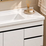 Countertop detail, integrated white sink, aromatherapy set on storage tray