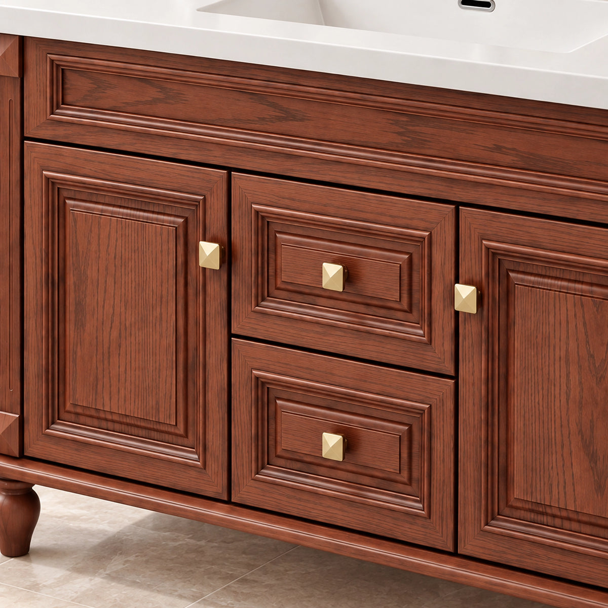 Door and drawer close‑up, embossed panel design with square gold metal knobs