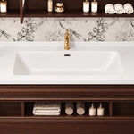 Bathroom vanity countertop and open cubbies with toiletries and folded towels