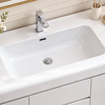 Integrated ceramic basin close‑up, rectangular sink with square chrome faucet