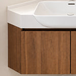 Partial view of vanity cabinet, handle‑less flat walnut wood‑grain door