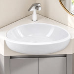 Close‑up of corner vessel sink, round ceramic basin with black‑white faucet